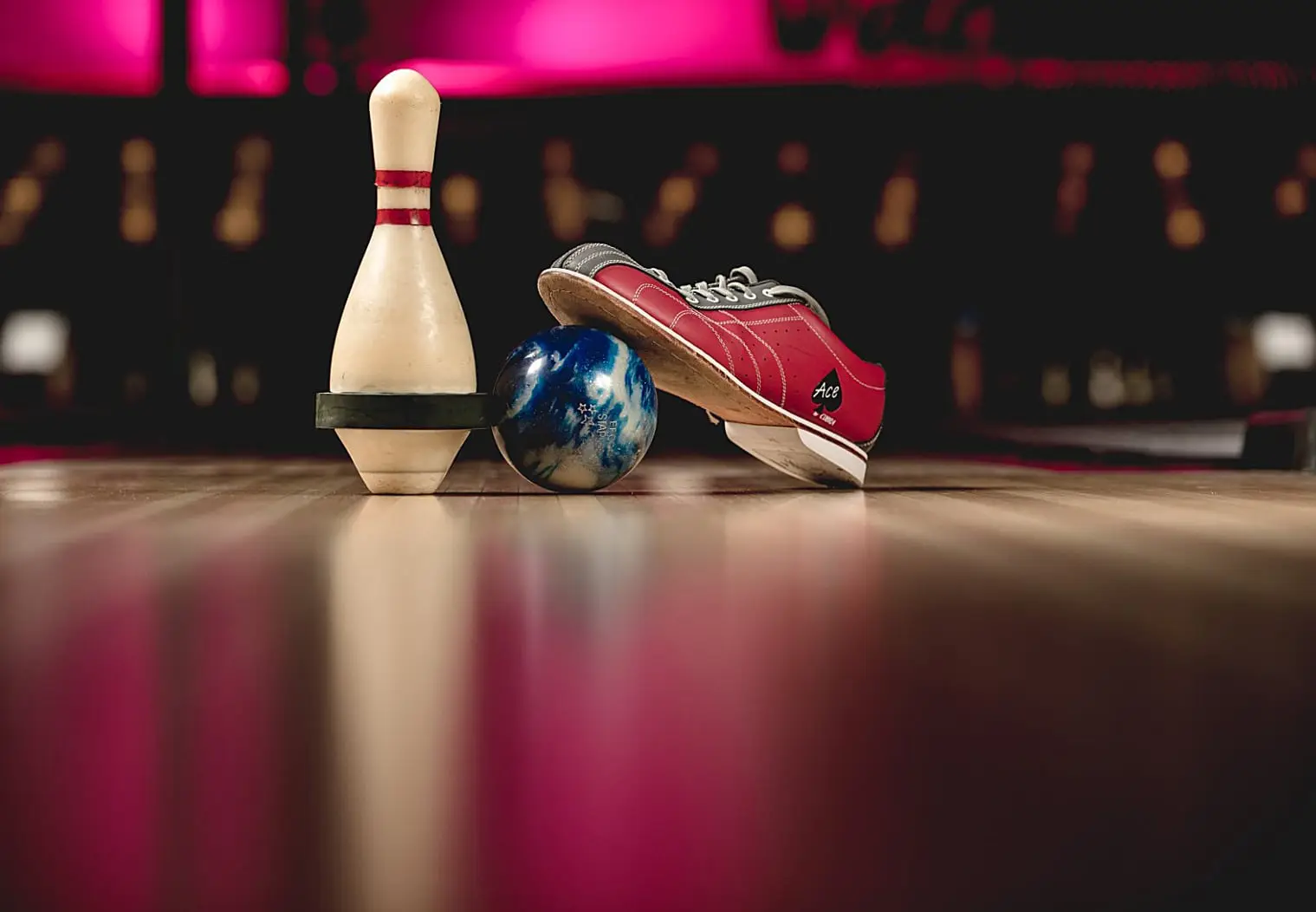Rental shoes, a five-pin ball and a pin at the end of a lane.